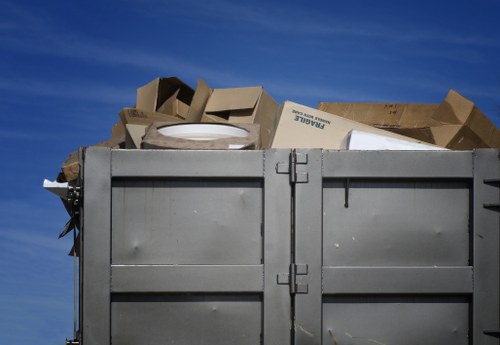 Staff inspecting waste containers during a service audit